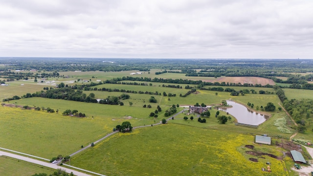 birds eye view of property featuring a water view and a rural view