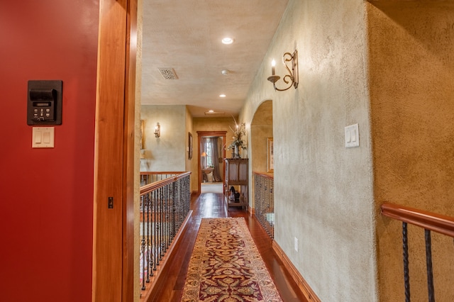 corridor featuring dark hardwood / wood-style floors