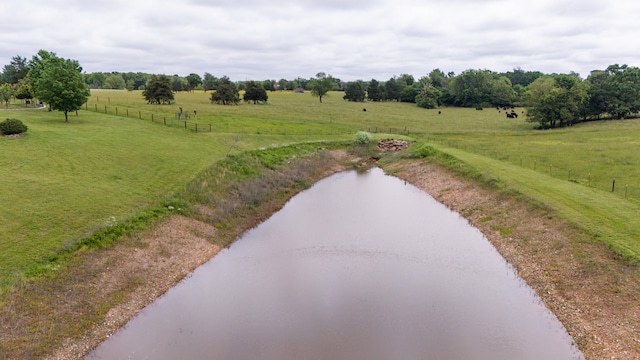 aerial view with a rural view and a water view