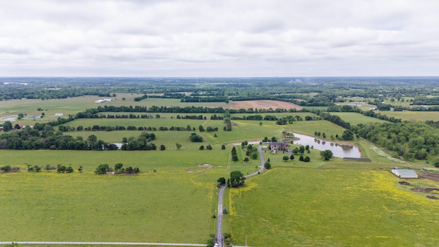 birds eye view of property with a water view and a rural view