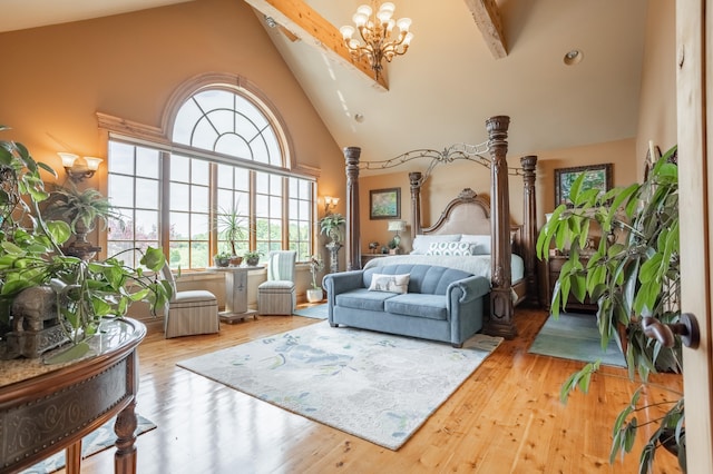 bedroom featuring wood-type flooring, high vaulted ceiling, multiple windows, and beamed ceiling