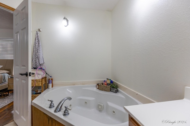 full bathroom featuring a tub with jets