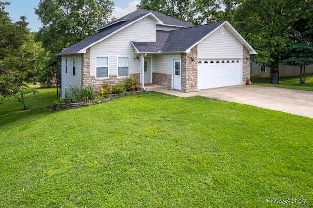 view of front of property featuring a garage and a front lawn