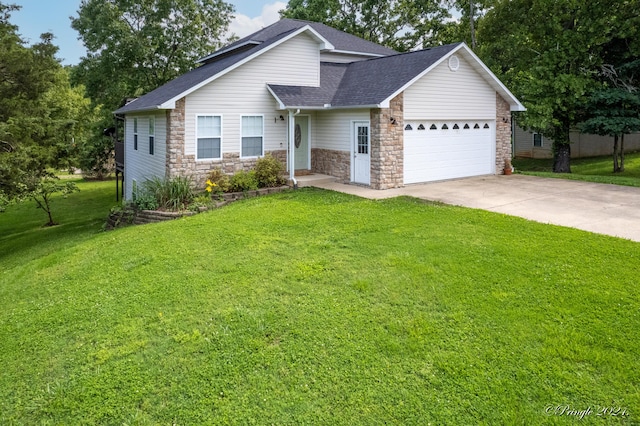 view of front of home with roof with shingles, a front lawn, driveway, stone siding, and a garage