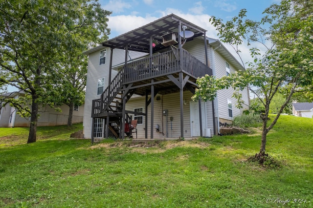 back of house featuring a wooden deck, a yard, and stairs
