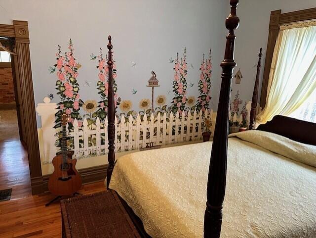 bedroom with hardwood / wood-style flooring