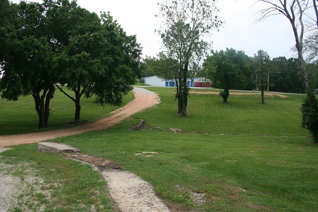 view of home's community with a lawn