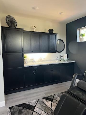 20949 Needles Eye Rd, Shell Knob, MO 65747 - bathroom featuring baseboards, wood finished floors, and vanity