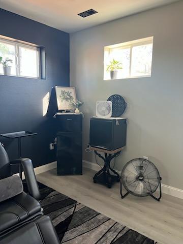 living area with hardwood / wood-style floors