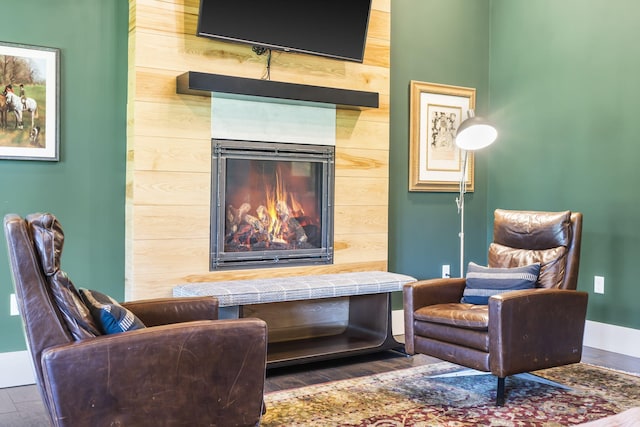 sitting room with dark hardwood / wood-style flooring