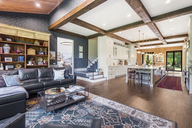 living room featuring coffered ceiling, beamed ceiling, a chandelier, and dark wood-type flooring