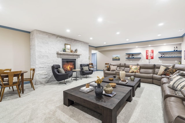 living room with light colored carpet, a fireplace, and crown molding