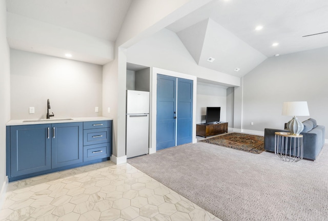 living room with light colored carpet, lofted ceiling, and sink