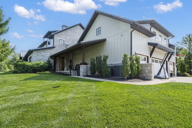 view of home's exterior with a garage and a yard