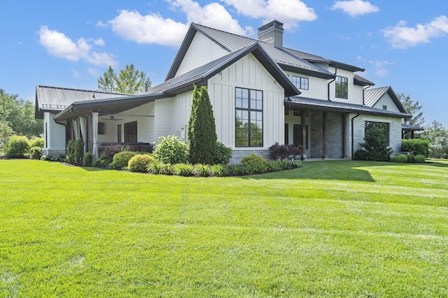 view of side of home featuring a yard