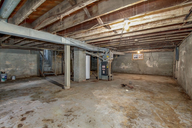 basement with water heater and heating unit