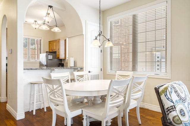 dining room featuring dark wood-type flooring