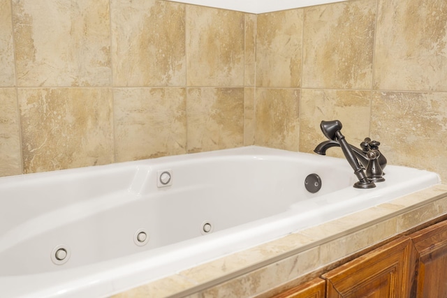 bathroom with tiled tub