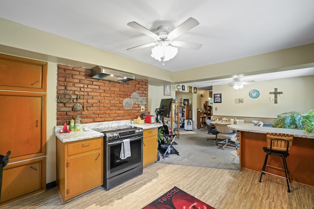 4587 E Farm Road 136, Springfield, MO 65809 - kitchen with light wood-style flooring, extractor fan, ceiling fan, and electric range