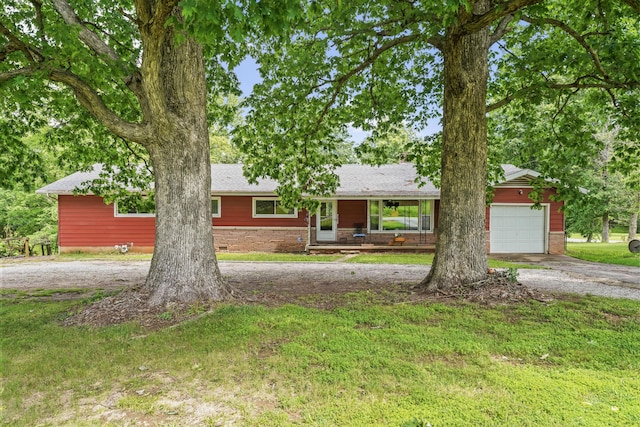 4587 E Farm Road 136, Springfield, MO 65809 - ranch-style home featuring driveway, stone siding, an attached garage, a shingled roof, and a front yard