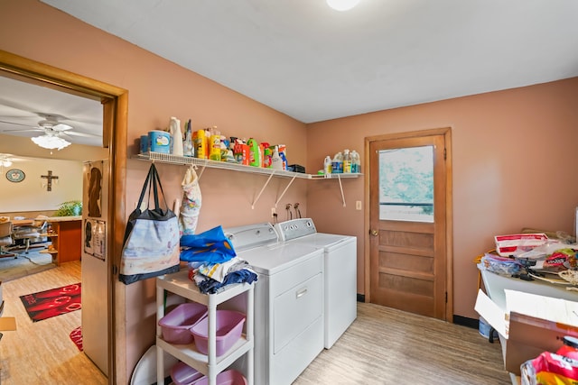 laundry area featuring ceiling fan, light wood-type flooring, and independent washer and dryer