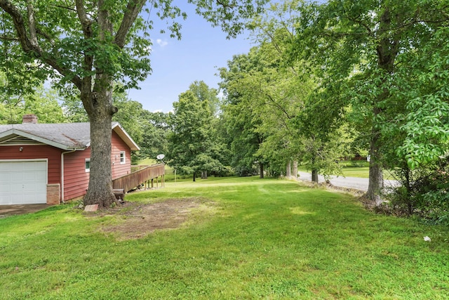 4587 E Farm Road 136, Springfield, MO 65809 - view of yard featuring a wooden deck and a garage