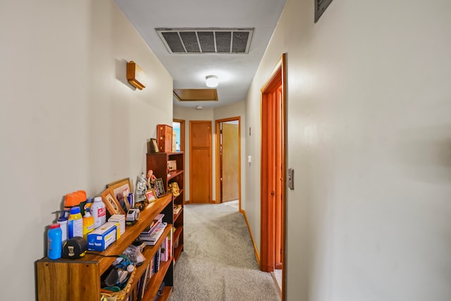 hallway featuring light carpet