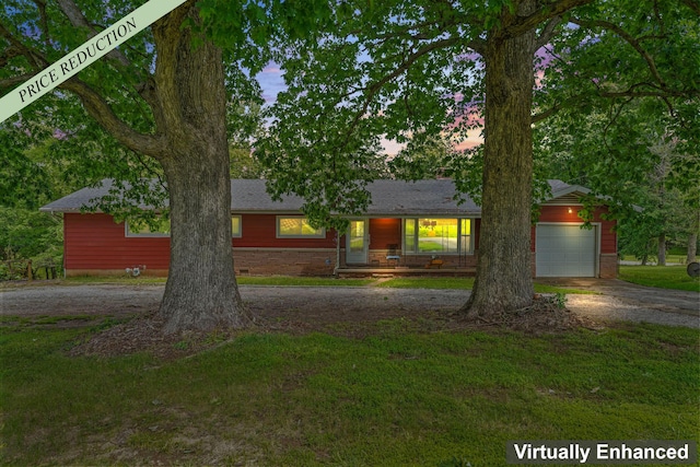 4587 E Farm Road 136, Springfield, MO 65809 - single story home featuring concrete driveway, stone siding, a front yard, and a garage