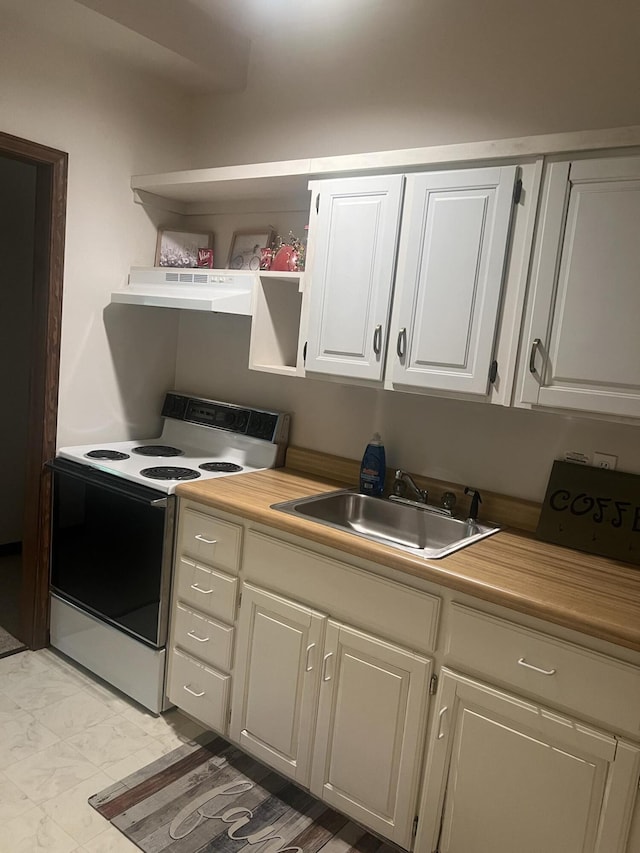 kitchen featuring marble finish floor, under cabinet range hood, open shelves, a sink, and electric range