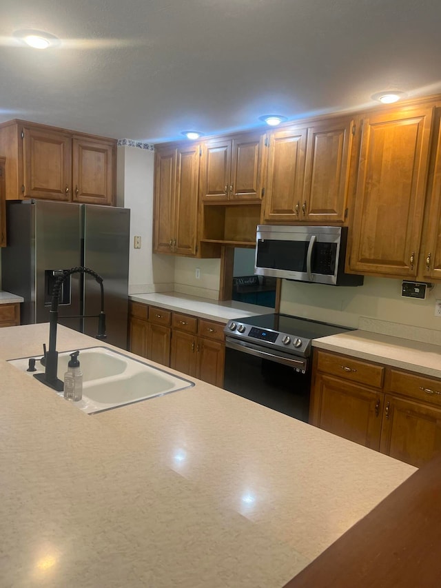 kitchen with appliances with stainless steel finishes and sink