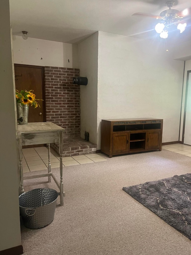 interior space featuring ceiling fan and light colored carpet