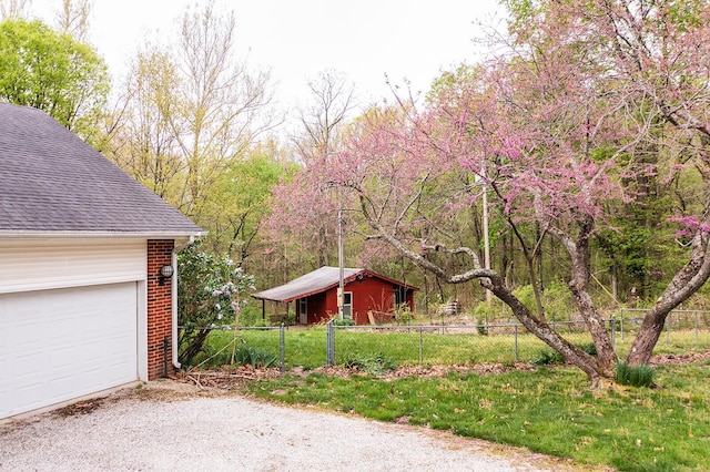 exterior space with fence and driveway