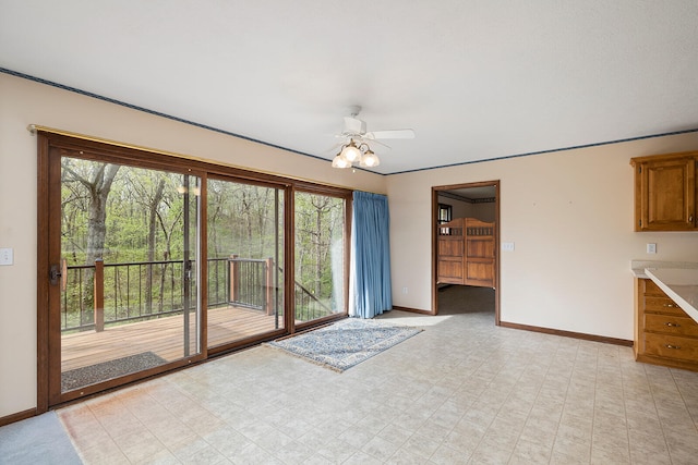 interior space with ceiling fan