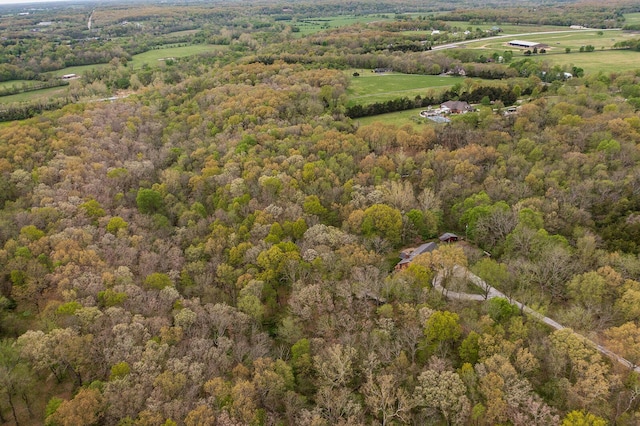 drone / aerial view featuring a rural view and a forest view