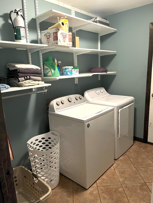 2800 Briaroaks Ln, Joplin, MO 64804 - laundry room with washing machine and dryer, tile patterned floors, and laundry area