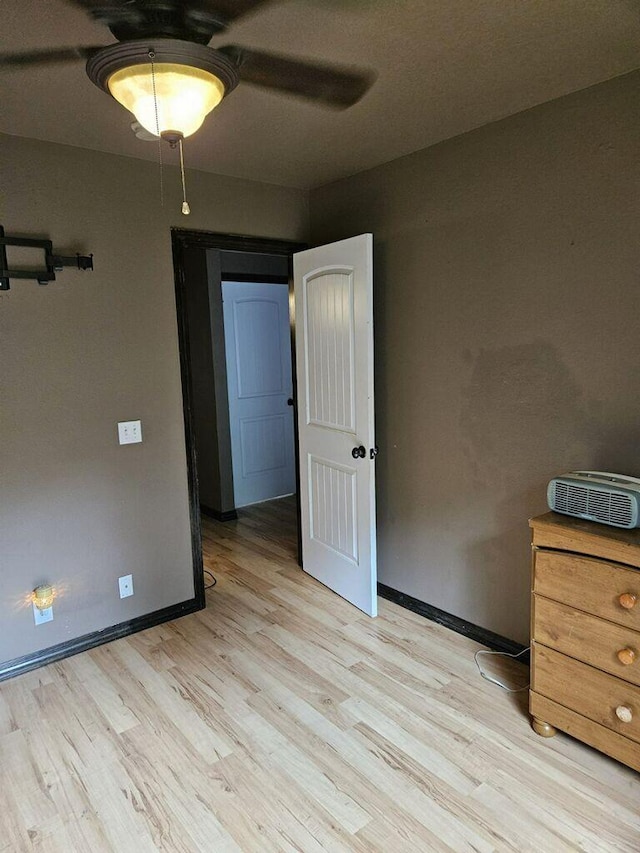 2800 Briaroaks Ln, Joplin, MO 64804 - bedroom featuring light wood-style flooring, a ceiling fan, and baseboards