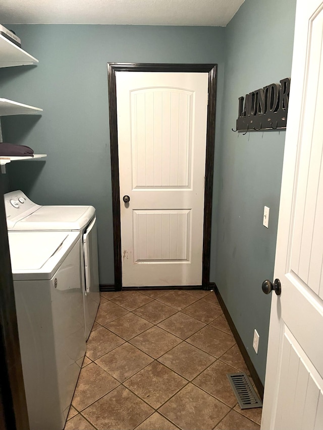 2800 Briaroaks Ln, Joplin, MO 64804 - laundry area featuring separate washer and dryer, visible vents, tile patterned flooring, and laundry area