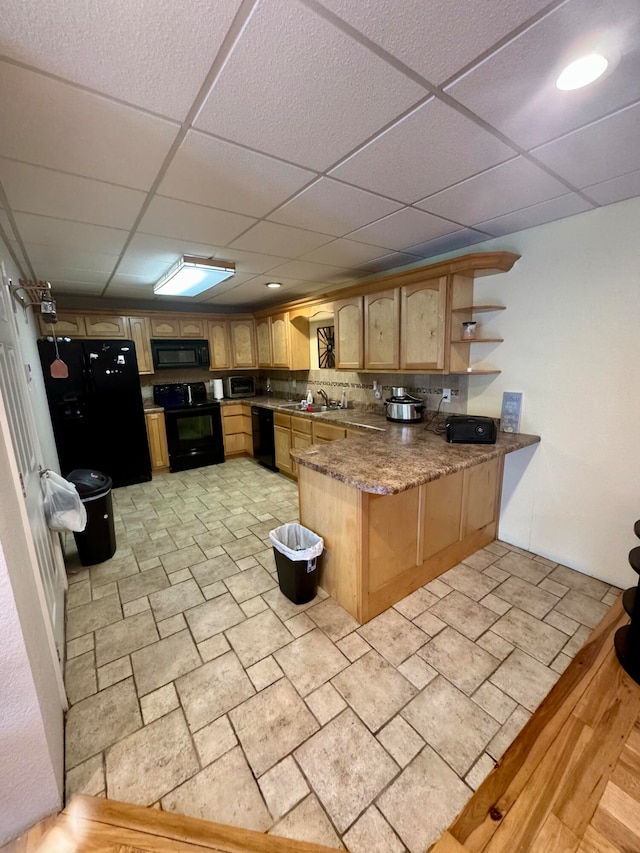 kitchen with tasteful backsplash, dark stone counters, sink, kitchen peninsula, and black appliances