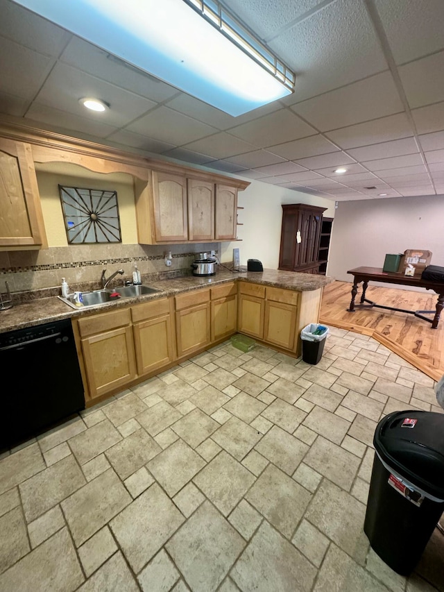 kitchen featuring decorative backsplash, light brown cabinets, sink, light hardwood / wood-style floors, and black dishwasher