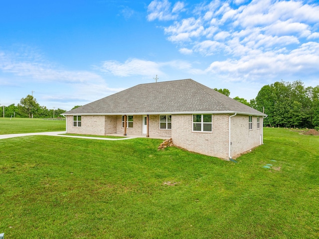 back of house with a lawn