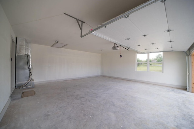 garage with refrigerator and a garage door opener