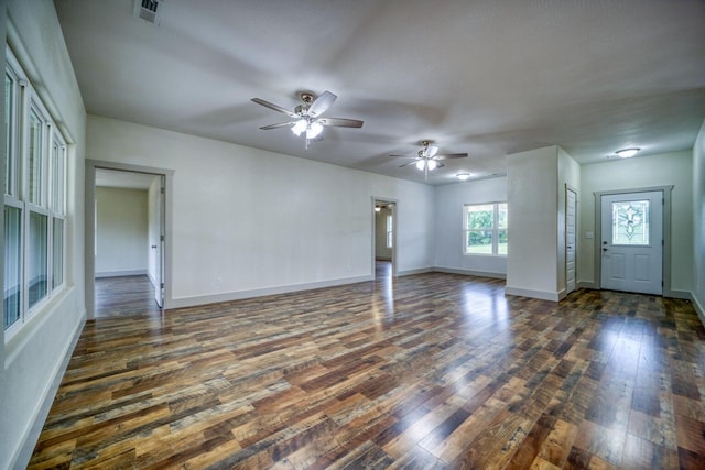 interior space featuring ceiling fan and dark wood-type flooring