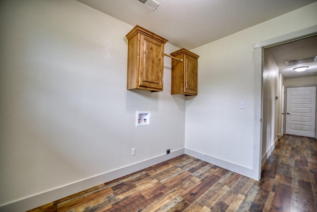 washroom featuring cabinets, hookup for a washing machine, electric dryer hookup, dark hardwood / wood-style floors, and a textured ceiling