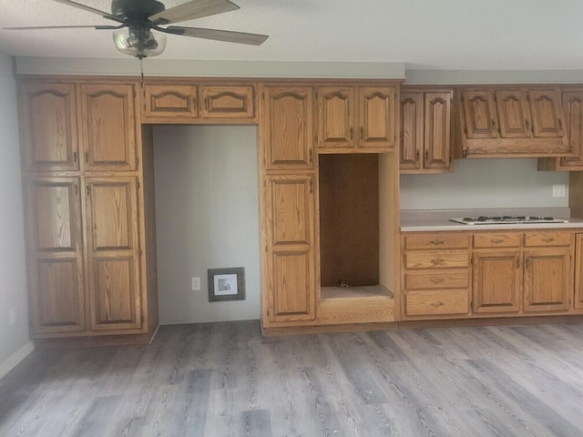 kitchen featuring ceiling fan, light hardwood / wood-style flooring, white gas cooktop, and custom range hood