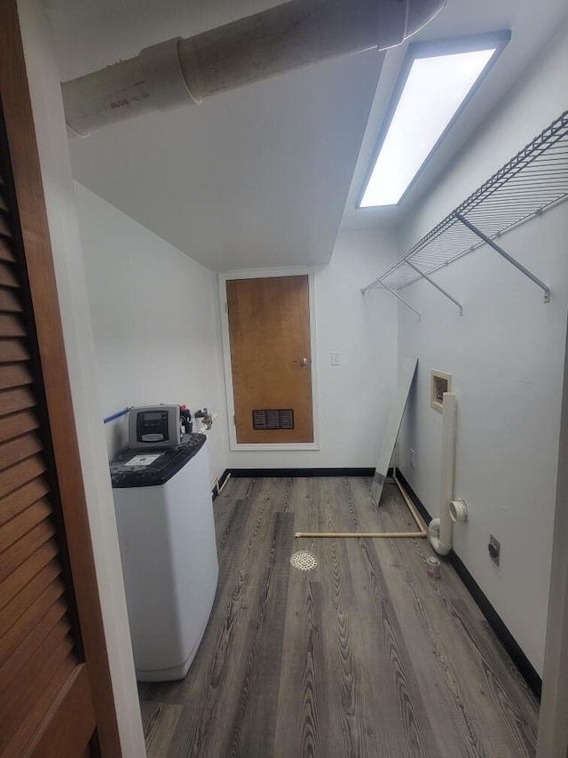 washroom featuring washer hookup and dark hardwood / wood-style floors