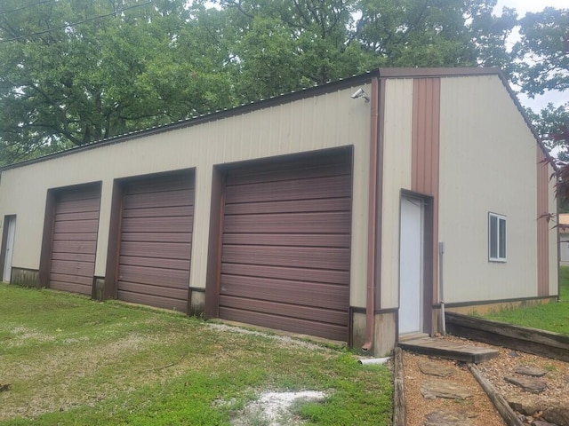 garage with a lawn