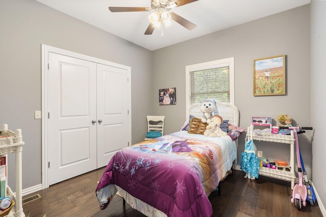 bedroom featuring a closet, dark hardwood / wood-style flooring, and ceiling fan