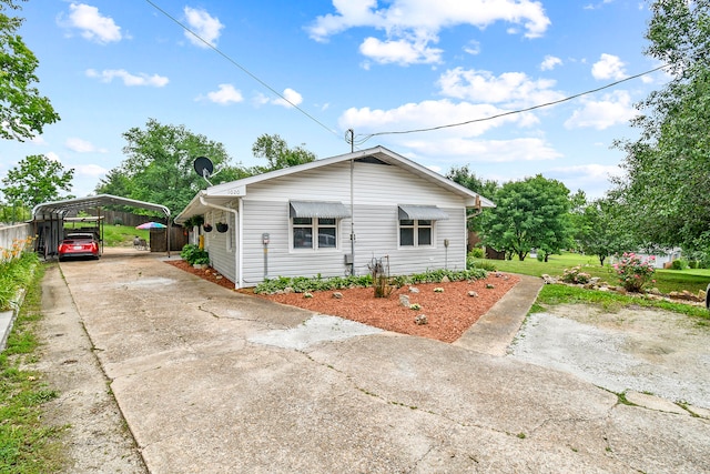 view of property exterior with a carport