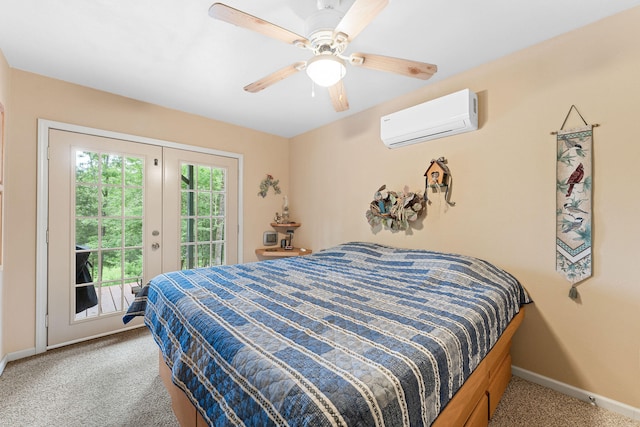 carpeted bedroom with access to exterior, a wall unit AC, ceiling fan, and french doors