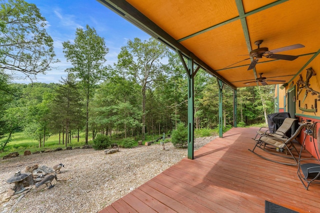 228 Cabin Ln, Kissee Mills, MO 65680 - wooden deck featuring ceiling fan and a wooded view